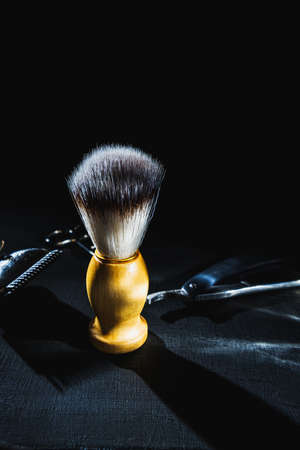 shaving brush on dark background hairdressing tools scissors manual hair clipperの写真素材