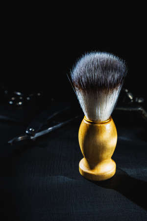 shaving brush on dark background hairdressing tools scissors manual hair clipperの写真素材