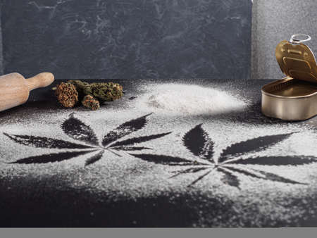 rustic cannabis butter and medical marijuana bud on black.の写真素材