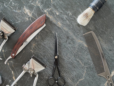 On a grey marble surface are old barber tools. top view. flat lay.の写真素材