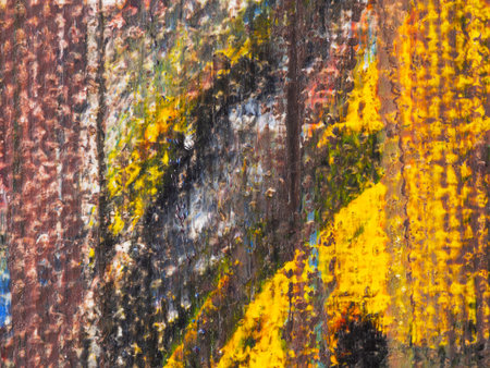 This vibrant abstract artwork features a mix of colors and textures. Bold yellows and deep shades intertwine, creating an energetic visual experience.の写真素材