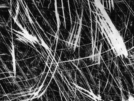 An intricate composition of white lines and textures contrasts against a black background, showing various scratches and patterns. The artwork evokes a sense of movement and abstraction.の写真素材