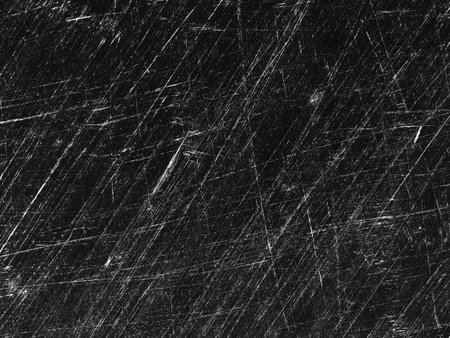 A textured surface shows numerous deep scratches and marks indicative of extensive use. The pattern...