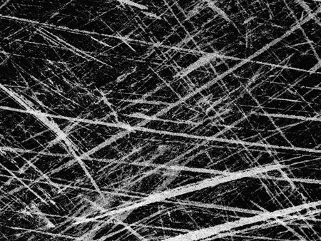 Intricate pattern of intersecting lines and scratches creates a striking black and white design, suggesting energy and complexity in the composition.の写真素材