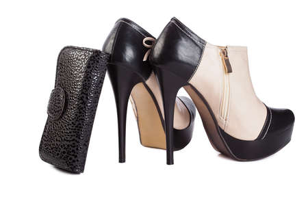 high heels boots and purse on white backgroundの写真素材