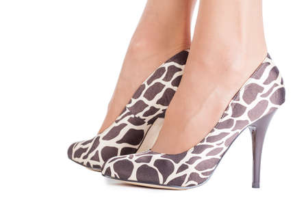 Giraffe print shoes on lady isolated on whiteの写真素材