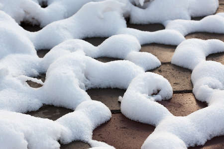 close up shot of a cobblestone in winter timeの写真素材