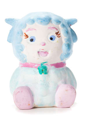 Sheep statue painted by kids isolated on whiteの写真素材