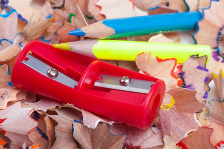 Colored pencil shavings and sharpenerの写真素材