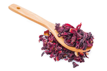 Dried hibiscus tea on wooden spoon on white backgroundの写真素材