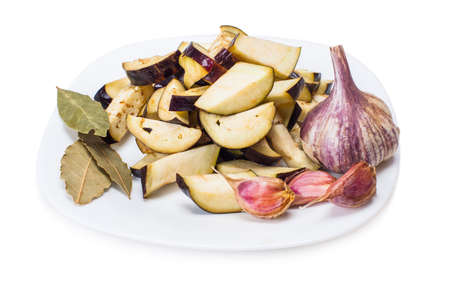 Sliced eggplant in the bowl isolated on whiteの写真素材