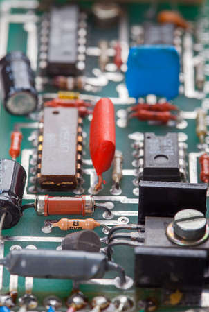 Detail of an electronic printed circuit board with many electrical components