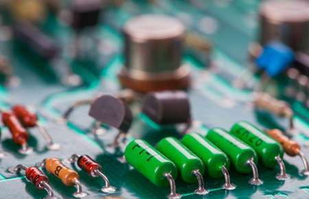 Detail of an electronic printed circuit board with many electrical componentsの写真素材
