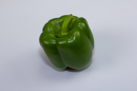 Fresh green bell pepper just plucked from the garden. Juicy peppers are always used by chefs in their restaurants. Green pepper goes well with all dishes. healthy eatingの写真素材