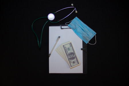 Medical background, isolated. A stethoscope, a tablet with a blank white sheet and one hundred...