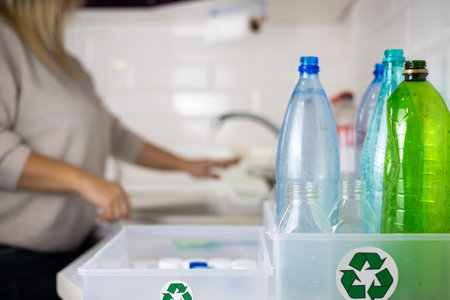Sorting plastic for recycling. Zero waste. A female eco activist is fighting to save the planet from...
