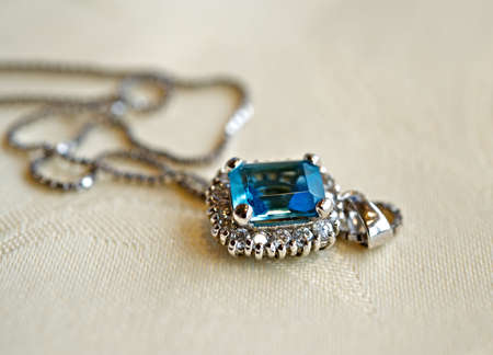 Suspension with a blue stone on a chain 