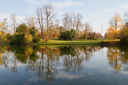 A little lake in the wonderful park of Boulogne in Paris; the Eiffel Tower can be seen at the distanceの写真素材
