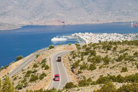 A road over the port town of Itea, near Delphi, central Greeceの写真素材