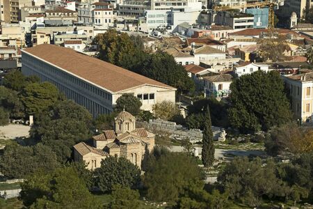 The ancient Market Agora and a small old Byzantine church in the old area of Athens, Greeceの写真素材