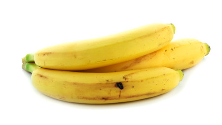 Yellow bananas on a white backgroundの写真素材