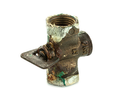 Old metal faucet on white backgroundの写真素材
