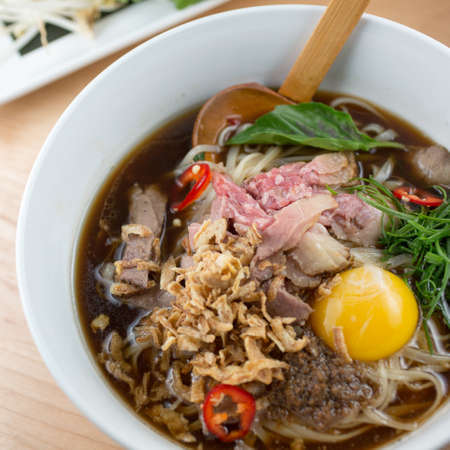 Beef Pho. Smoked Rare Brisket
Crispy Shallot, Scallion, Roasted Garlic Sauce and Rice Noodles and raw eggの写真素材