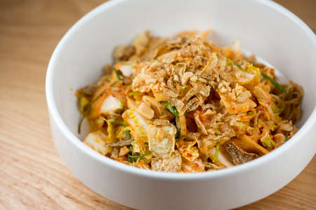 Sweet &amp; Sour.
Creamy Kimchi Dressing, Nappa Cabbage, Pickled Melon and Cashewの写真素材