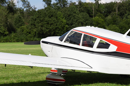Small propeller airplane on the airfield, closeup of photo