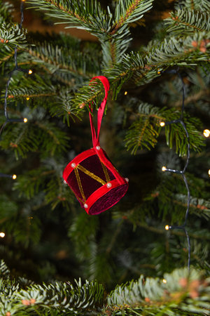 Christmas decoration hanging on the branches of a Christmas tree, close-up