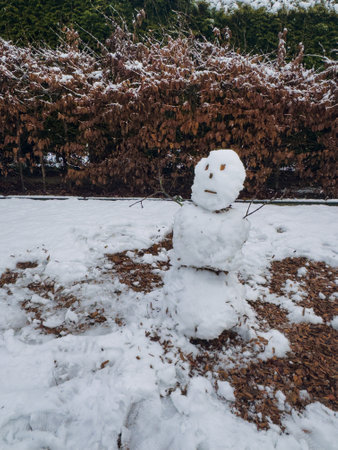 snowman made of snow on the playgroundの写真素材