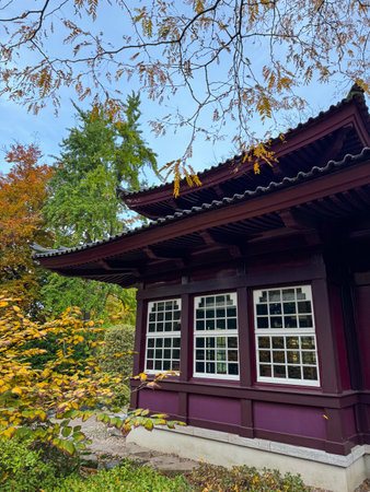 Korean traditional house in the autumn park. Traditional Korean architecture.