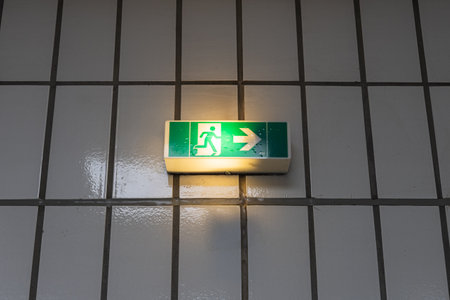 Emergency exit sign on the wall of a building