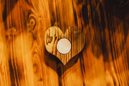 Valentines day greeting card. Heart on the wooden background.の写真素材