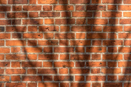 brick red wall. background of a old brick house.