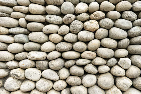 White pebble stone texture background. Pile of pebble stones.
