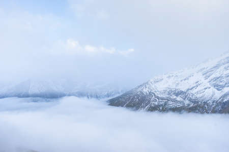 Fog and clouds on mountain. High mountain in mist and cloudの写真素材