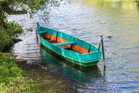 Rowing boat floating over the Lake. Fishing lake in early summer.の写真素材