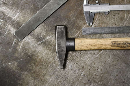 Set of various home tools lying in row on old metal background. Men's style. high quality photoの写真素材