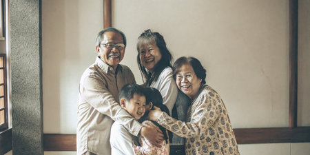 Smiling Family Bonding Together in a Warm Indoor Settingの素材