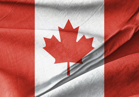 Waved Textured canadian flag with a maple leaf on it Symbの写真素材