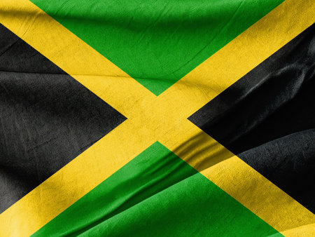 Waved Textured A close up of a jamaican flag with a black background Symbolizing National Identity and Unityの写真素材