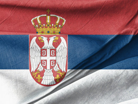 Waved Textured Arafed flag of serbia with a crown and two headed eagle Symbolizing National Identity and Unityの写真素材