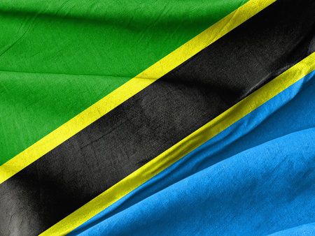 Waved Textured A close up of a flag of the tanzanian country Symbolizing National Identity and Unityの写真素材