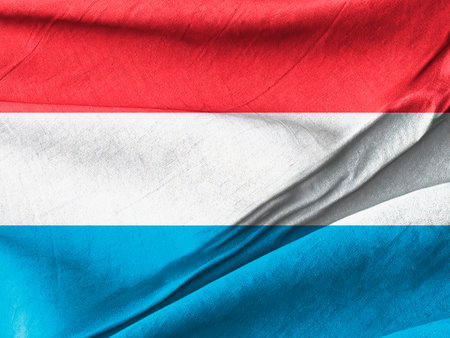 Luxembourg National Flag Displaying Colors of Red, White, and Blue in Fabric Formの写真素材