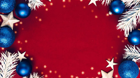 Festive Christmas Frame with Red Background, Blue Ornaments, and White Decorationsの素材