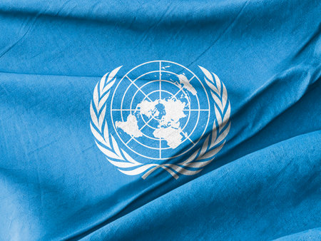 Blue Flag with Emblem Representing Global Unity and Cooperationの写真素材