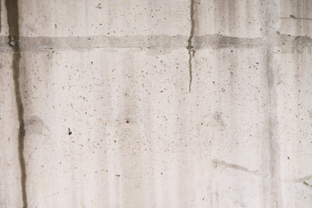 Elegant Businessman Standing at the Wallの写真素材