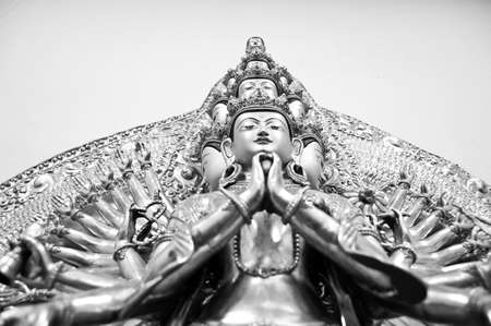 Buddha statue of the Avalokiteshvara. Multi-headed and multi-armedの写真素材