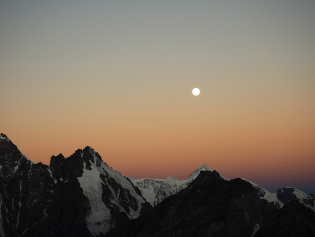 early morning. mountain peaks. dawn moon caucasus